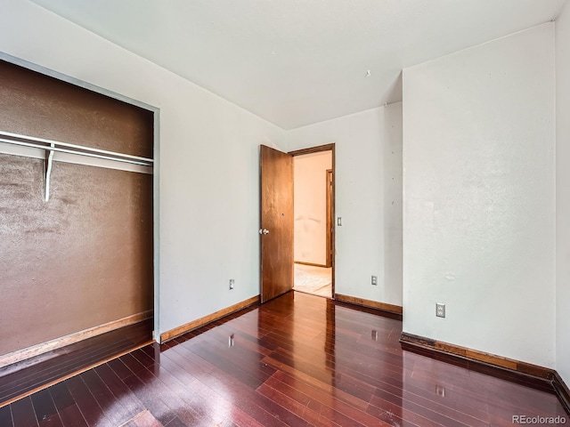 4032 S Atchison Way, Aurora, CO 80014 - unfurnished bedroom featuring wood-type flooring and a closet