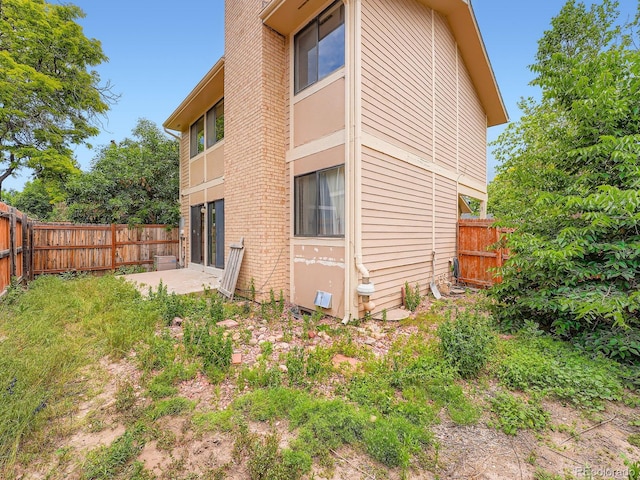 4032 S Atchison Way, Aurora, CO 80014 - back of property with a patio area and a fenced backyard
