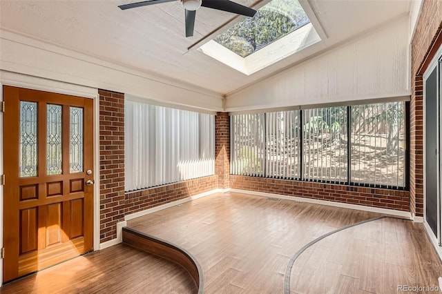 sunroom featuring a skylight