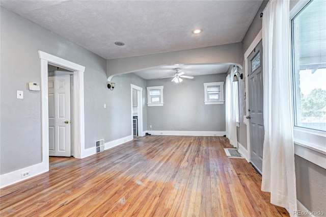 3336 N Saint Paul St, Denver, CO 80205 - spare room with arched walkways, light wood-style flooring, a ceiling fan, baseboards, and recessed lighting