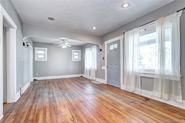 3336 N Saint Paul St, Denver, CO 80205 - entryway featuring wood-type flooring, baseboards, a ceiling fan, recessed lighting, and arched walkways