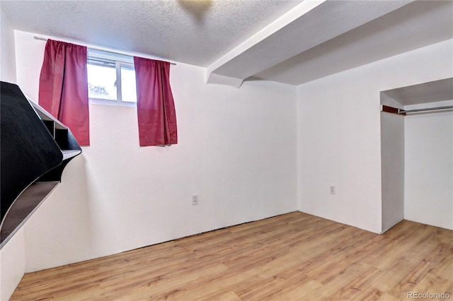 3336 N Saint Paul St, Denver, CO 80205 - basement with wood finished floors and a textured ceiling