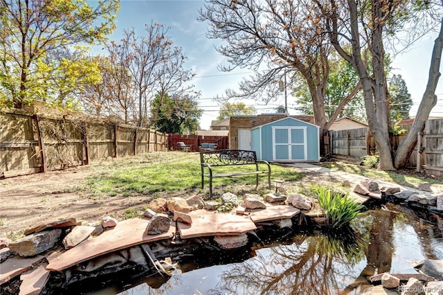 3336 N Saint Paul St, Denver, CO 80205 - view of yard with a storage shed, a small pond, and an outdoor structure