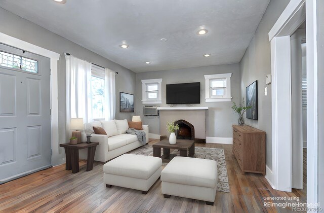 3336 N Saint Paul St, Denver, CO 80205 - living area with healthy amount of natural light, wood finished floors, baseboards, and recessed lighting