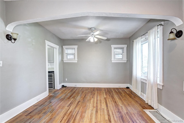 3336 N Saint Paul St, Denver, CO 80205 - spare room with healthy amount of natural light, wood finished floors, a ceiling fan, and baseboards