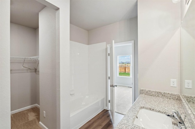 bathroom with hardwood / wood-style flooring and vanity