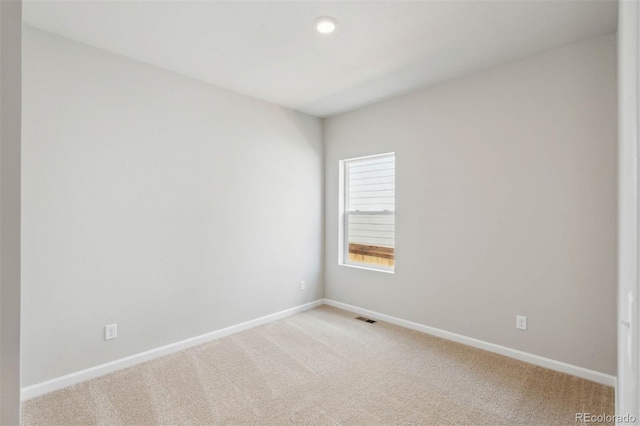 spare room with carpet floors