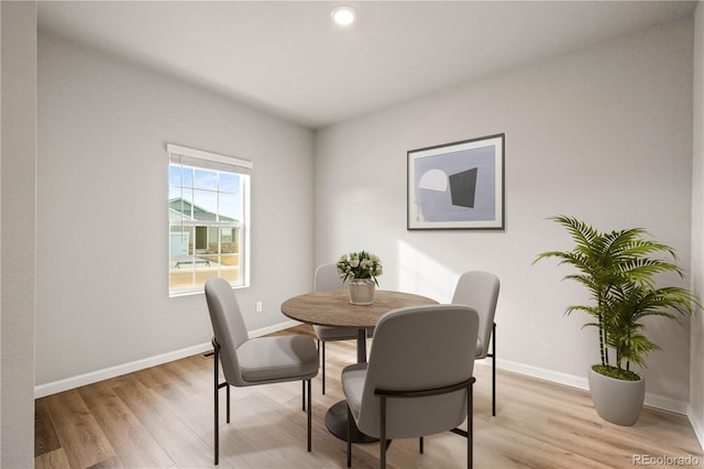 dining space with light wood-type flooring