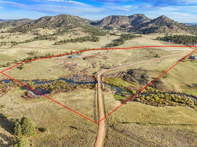 224 Lakeview Forest Hts, Florissant, CO 80816 - aerial view of sparsely populated area with property parcel outlined and a mountain backdrop