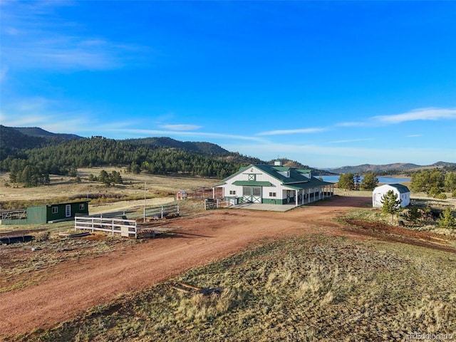 224 Lakeview Forest Hts, Florissant, CO 80816 - view of front of property featuring a mountain view, a view of rural / pastoral area, driveway, and an outbuilding