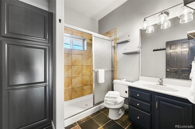 224 Lakeview Forest Hts, Florissant, CO 80816 - bathroom featuring toilet, a shower stall, vanity, and tile patterned floors
