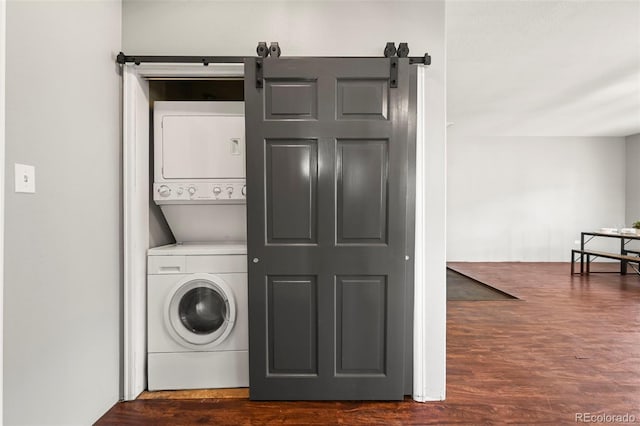 224 Lakeview Forest Hts, Florissant, CO 80816 - laundry area with stacked washer / drying machine, dark wood finished floors, and a barn door