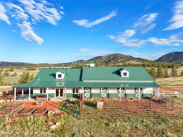 224 Lakeview Forest Hts, Florissant, CO 80816 - view of front of property with a mountain view, metal roof, and a patio area