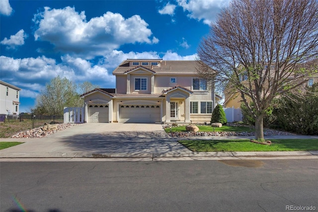 21229 E 50th Ave, Denver, CO 80249 - view of front of property featuring a garage, stucco siding, a tile roof, fence, and driveway