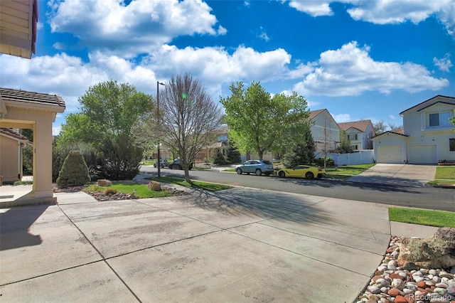 21229 E 50th Ave, Denver, CO 80249 - view of street with driveway, street lighting, and a residential view