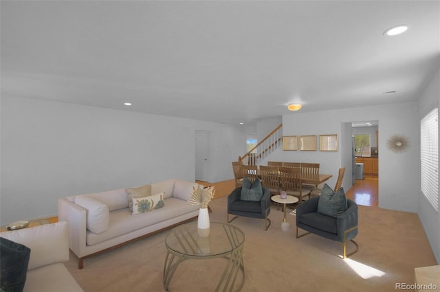 21229 E 50th Ave, Denver, CO 80249 - living area with recessed lighting, stairway, and light carpet