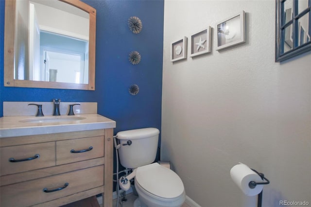 21229 E 50th Ave, Denver, CO 80249 - half bath featuring toilet, baseboards, and vanity