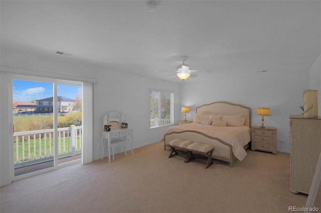 21229 E 50th Ave, Denver, CO 80249 - carpeted bedroom with a ceiling fan, visible vents, and access to exterior