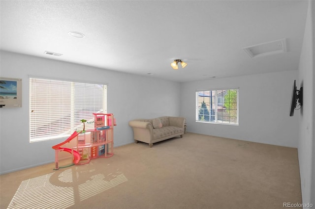 21229 E 50th Ave, Denver, CO 80249 - game room featuring carpet flooring, visible vents, and attic access