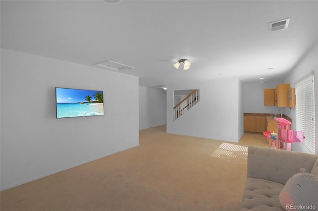 21229 E 50th Ave, Denver, CO 80249 - living area featuring attic access, visible vents, and light carpet