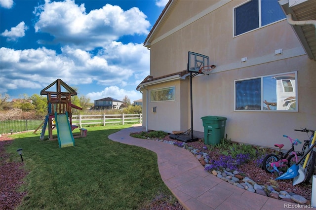 21229 E 50th Ave, Denver, CO 80249 - view of yard featuring a playground and fence