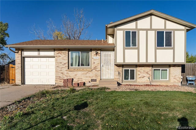 view of front facade featuring entry steps, a front lawn, an attached garage, and brick siding