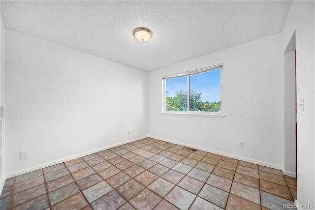 4064 S Himalaya Way, Aurora, CO 80013 - empty room with a textured ceiling and baseboards