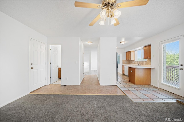 4064 S Himalaya Way, Aurora, CO 80013 - unfurnished living room featuring light carpet, ceiling fan, a textured ceiling, and light tile patterned floors