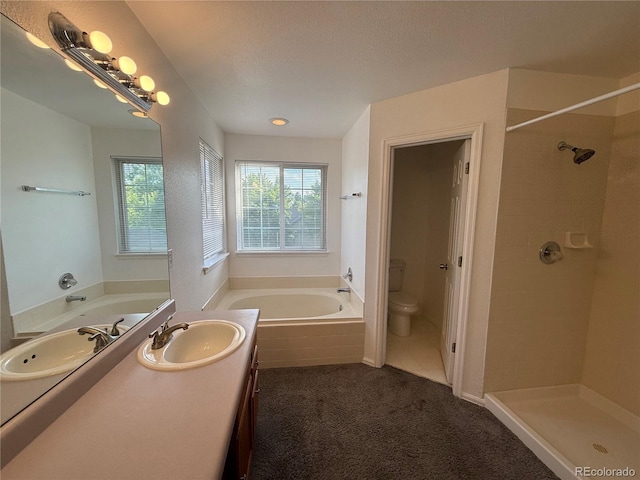 4064 S Himalaya Way, Aurora, CO 80013 - full bath featuring a garden tub, healthy amount of natural light, vanity, and tiled shower