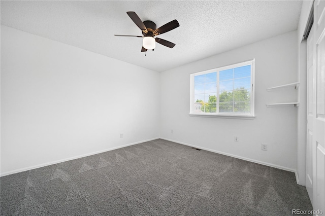 4064 S Himalaya Way, Aurora, CO 80013 - spare room featuring dark carpet, ceiling fan, and a textured ceiling