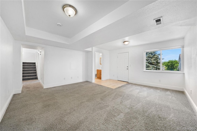 4064 S Himalaya Way, Aurora, CO 80013 - carpeted empty room featuring stairway, a smoke detector, and a raised ceiling