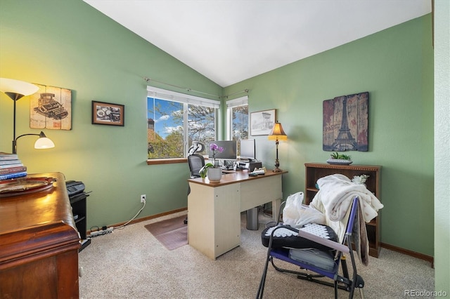 office space with baseboards, carpet flooring, and lofted ceiling