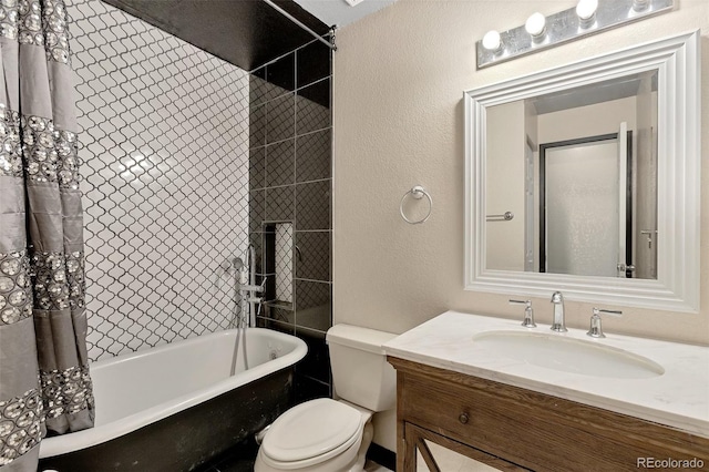 bathroom with toilet and large vanity