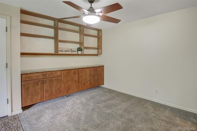 6505 Kalua Rd Unit 104B, Boulder, CO 80301 - empty room featuring light colored carpet, a ceiling fan, and baseboards