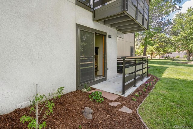 6505 Kalua Rd Unit 104B, Boulder, CO 80301 - property entrance with stucco siding and a yard