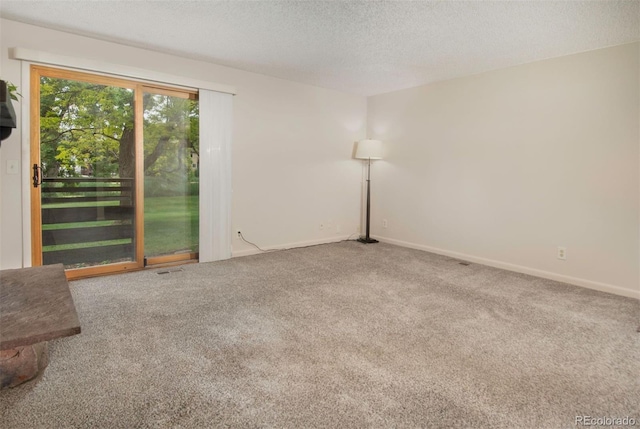 6505 Kalua Rd Unit 104B, Boulder, CO 80301 - carpeted spare room with a textured ceiling and baseboards
