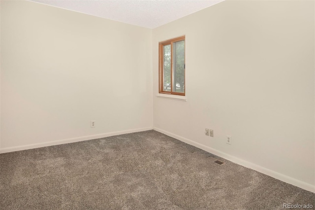 6505 Kalua Rd Unit 104B, Boulder, CO 80301 - unfurnished room with carpet and a textured ceiling