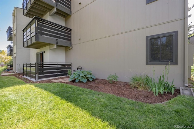 6505 Kalua Rd Unit 104B, Boulder, CO 80301 - view of side of home with a balcony and a yard