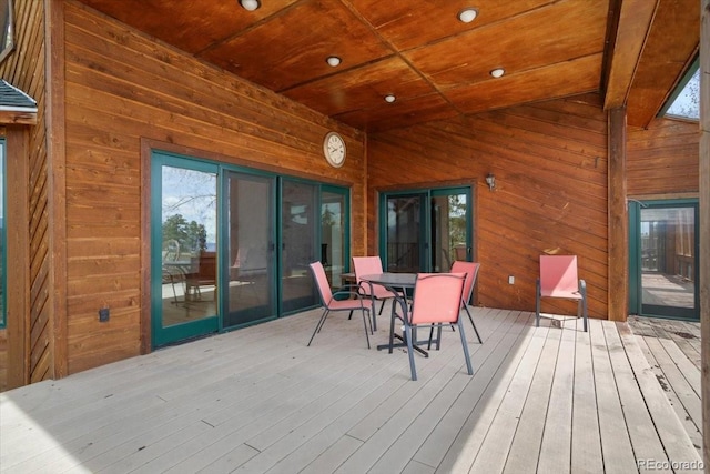 wooden deck featuring outdoor dining space