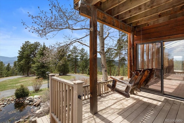 wooden deck featuring a mountain view