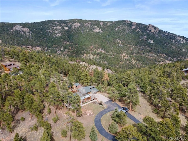 bird's eye view featuring a mountain view and a forest view