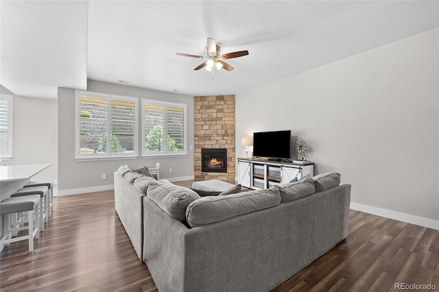 12214 Stone Timber Ct, Parker, CO 80134 - living area featuring ceiling fan, dark wood-style floors, and a fireplace