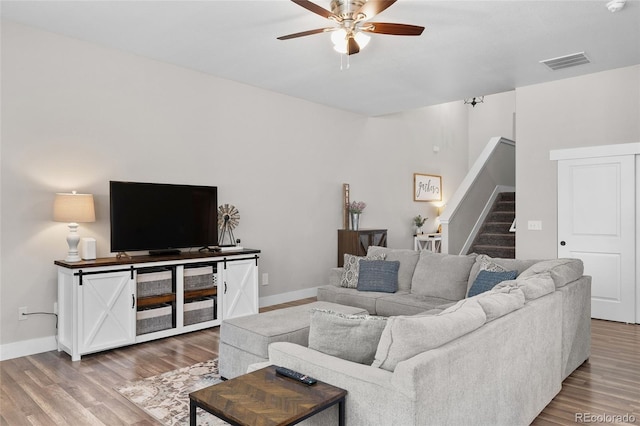 12214 Stone Timber Ct, Parker, CO 80134 - living area with stairs, a ceiling fan, and wood finished floors