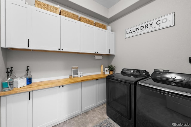 12214 Stone Timber Ct, Parker, CO 80134 - laundry area with cabinet space and washing machine and dryer