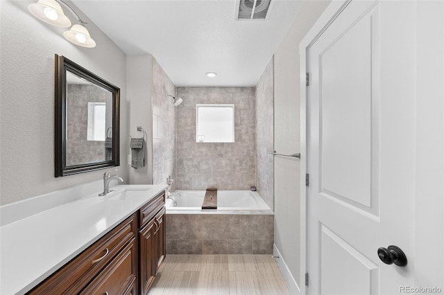 12214 Stone Timber Ct, Parker, CO 80134 - bathroom with vanity and tiled shower / bath combo