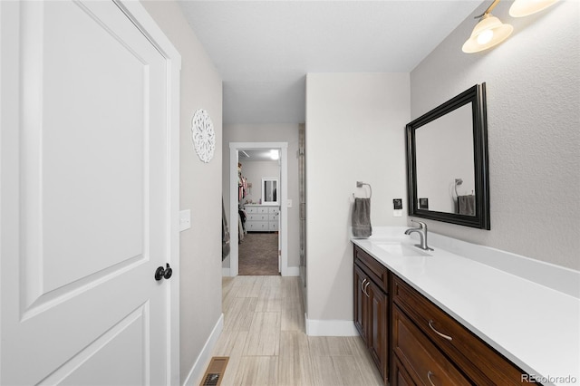 12214 Stone Timber Ct, Parker, CO 80134 - bathroom featuring vanity and baseboards