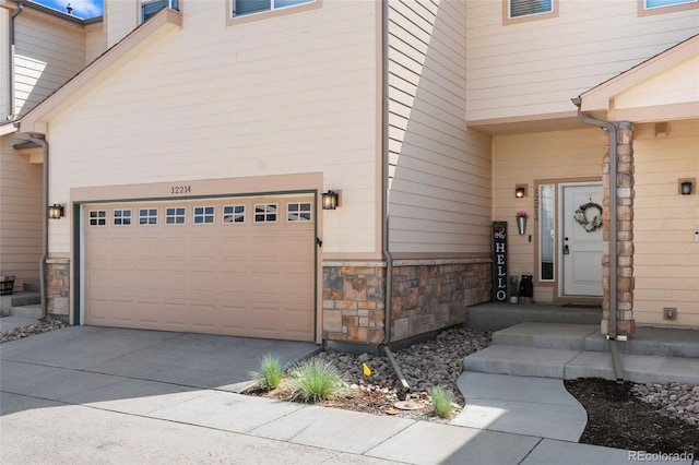 12214 Stone Timber Ct, Parker, CO 80134 - doorway to property featuring stone siding and driveway