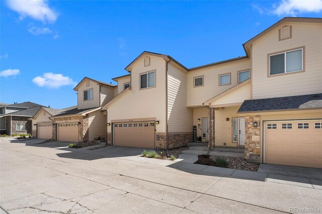 12214 Stone Timber Ct, Parker, CO 80134 - view of property with stone siding and an attached garage