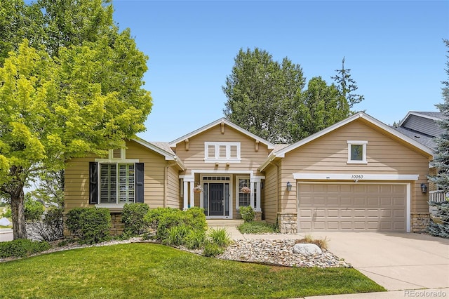 10050 Eagle Valley Way, Highlands Ranch, CO 80129 - traditional-style home with concrete driveway, stone siding, a front lawn, and an attached garage