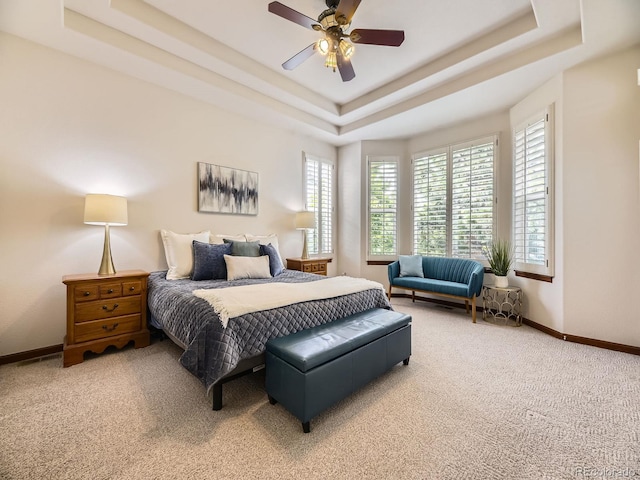 10050 Eagle Valley Way, Highlands Ranch, CO 80129 - carpeted bedroom featuring a raised ceiling and a ceiling fan